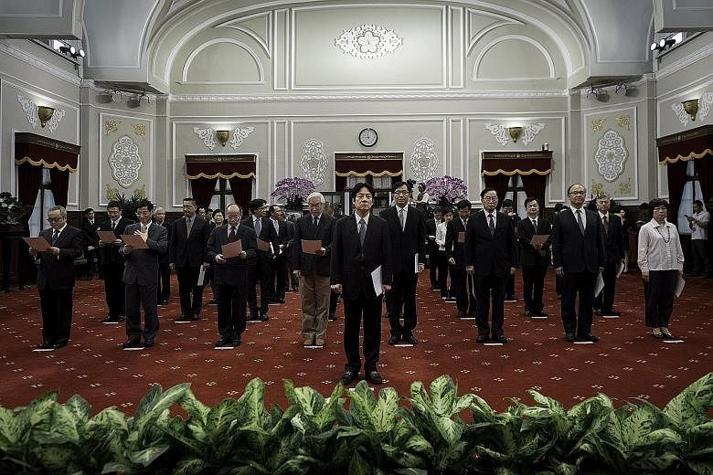 Taiwan's newly appointed Premier William Lai Ching-te (centre) with his Cabinet during yesterday's inauguration.