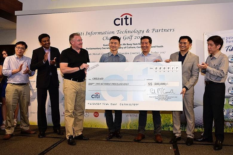 From left: Mr Paul McCarroll, head of Citi Technology Infrastructure; Parliamentary Secretary for Culture, Community and Youth Baey Yam Keng; and ChildAid 2017 co-chairs Marc Lim and Helmi Yusof at the Citi Information Technology and Partners charity