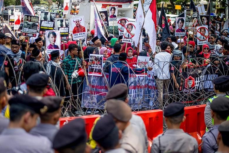 Demonstrators taking part in a rally outside the Myanmar Embassy in Jakarta yesterday, one of several protests that took place in Asian cities to condemn the violence in Myanmar's Rakhine state. Rohingya refugees living in Malaysia joining the protes