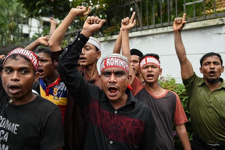 Demonstrators taking part in a rally outside the Myanmar Embassy in Jakarta yesterday, one of several protests that took place in Asian cities to condemn the violence in Myanmar's Rakhine state. Rohingya refugees living in Malaysia joining the protes