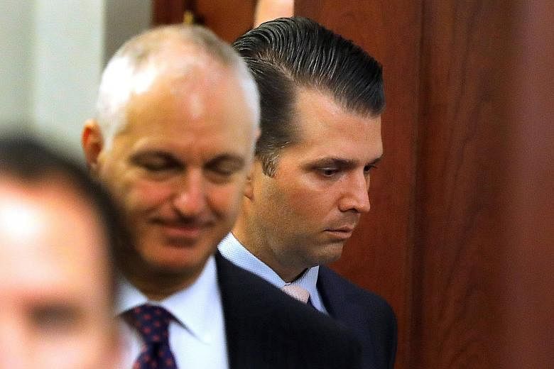 Mr Donald Trump Jr (far right) was grilled on a range of issues including the Trump Organisation's plans to build a skyscraper in Moscow.