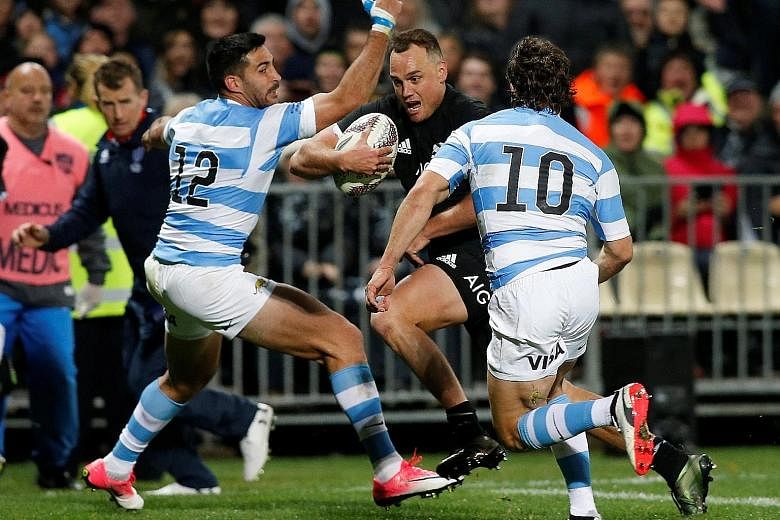 New Zealand's Israel Dagg charging his way through Argentina's defence to score a try. The Pumas gave the All Blacks, who will play the Springboks on Saturday in Auckland, a scare before the home side ran out convincing winners.