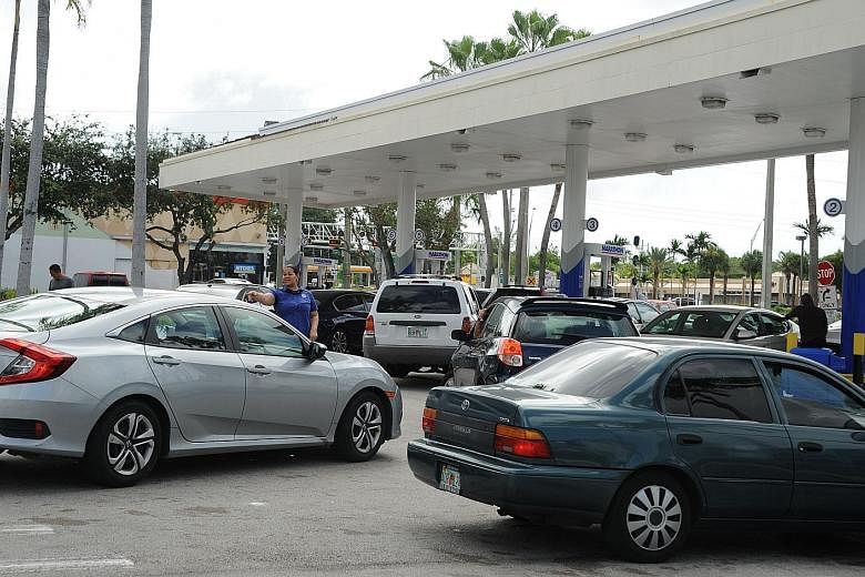 People waiting to fill up their tanks in Miami, Florida, last Friday as a petrol shortage hit the US state amid preparations for Hurricane Irma. Florida residents stocking up yesterday ahead of Hurricane Irma.