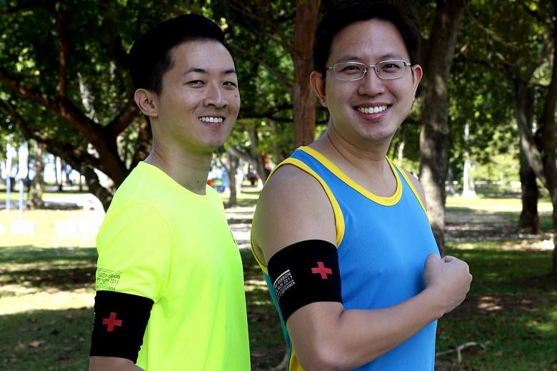Nurse manager Loh Lip Chiang, 38 (left), and Dr Henry Chua, 34, who both work for healthcare provider Parkway Pantai, are among the first aiders who will run with black armbands at the Yellow Ribbon Prison Run.