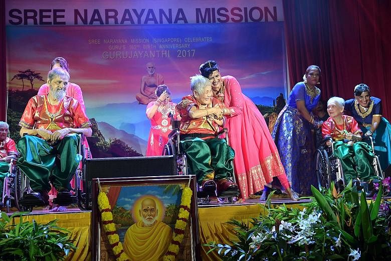 Sree Narayana Mission Nursing Home resident Tan Geok Kuan (centre) performing during the mission's celebrations yesterday to mark 163 years since Indian philosopher Sree Narayana Guru's birth.
