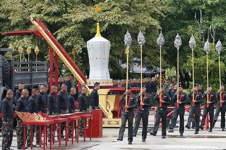 Royal Thai Army officers in training last Thursday for the ceremony, set to start on Oct 25. Those chosen to pull the funeral chariots had to pass strength and endurance tests.