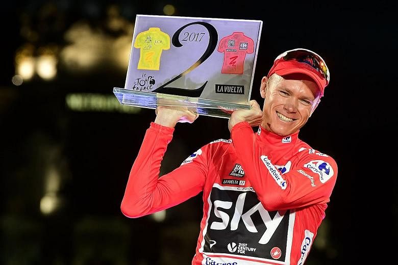 Team Sky's British cyclist Chris Froome celebrating on the podium on Sunday after winning the 72nd edition of the Tour of Spain. He is just the third rider to win the Vuelta a Espana and Tour de France in the same year.