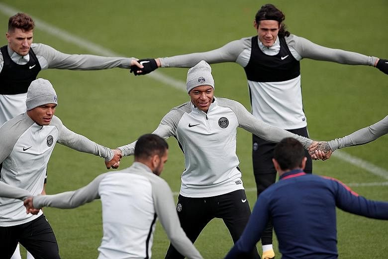 Paris Saint-Germain's Kylian Mbappe (centre) training with his new team-mates in preparation for today's Champions League clash with Celtic. He scored on his Ligue 1 debut against Metz following a loan move from Monaco.