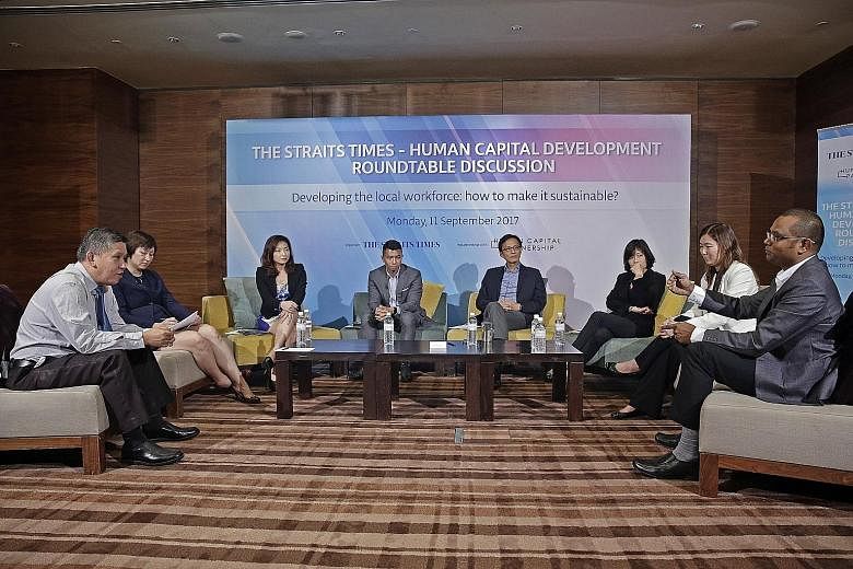 (From left) ST manpower correspondent Toh Yong Chuan with panellists Selena Huynh, deputy CEO of the Institute for Human Resource Professionals; Merle Chen, chief talent officer of The Lo & Behold Group; Kenneth Wong, director of Workforce Singapore'
