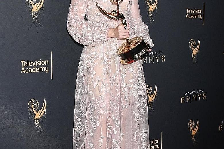 Alexis Bledel with her Drama Guest Actress trophy at The Creative Arts Emmy Awards.