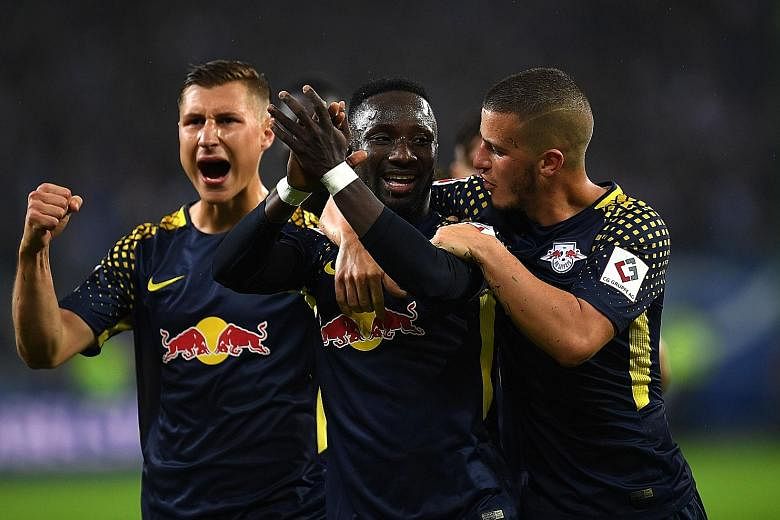 RB Leipzig's Naby Keita (centre) and his team-mates celebrating his opener against Hamburg last Saturday. This will be Leipzig's first Champions League outing.
