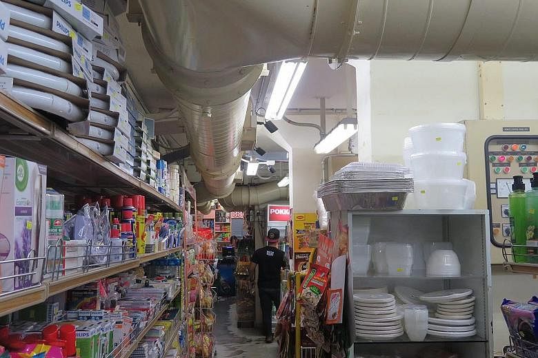 Businesses located in bomb shelters cannot alter the structure but can add lights and such, which is what Fair Price Underground Superstore has done. Fair Price Underground Superstore in the basement of Block 539, Hougang Street 52. The store's super