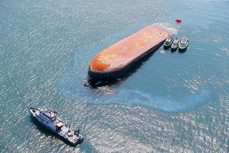 The Dominican-registered dredger JBB De Rong 19 capsized and was left partially submerged after yesterday's accident, which took place in the waters off Sisters' Islands.