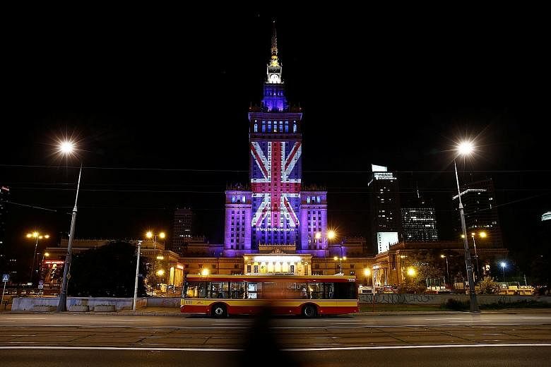 The Palace of Culture and Science in the Polish capital Warsaw lit up in the colours of the Union Jack last year to support Britain's staying in the EU. Yesterday, European Commission chief Jean-Claude Juncker signalled that Britain would regret its 