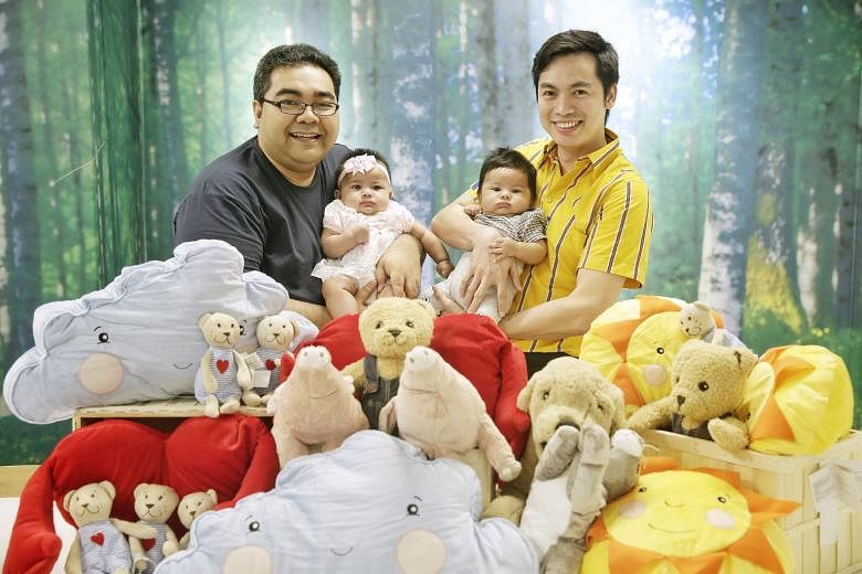 Among the new fathers at Ikea who have benefited from its paternity leave are Mr Masree Mascomb (left), with his daughter Nur Maisarah, and Mr Dingson Balahadia, with his son Elijah Diego.