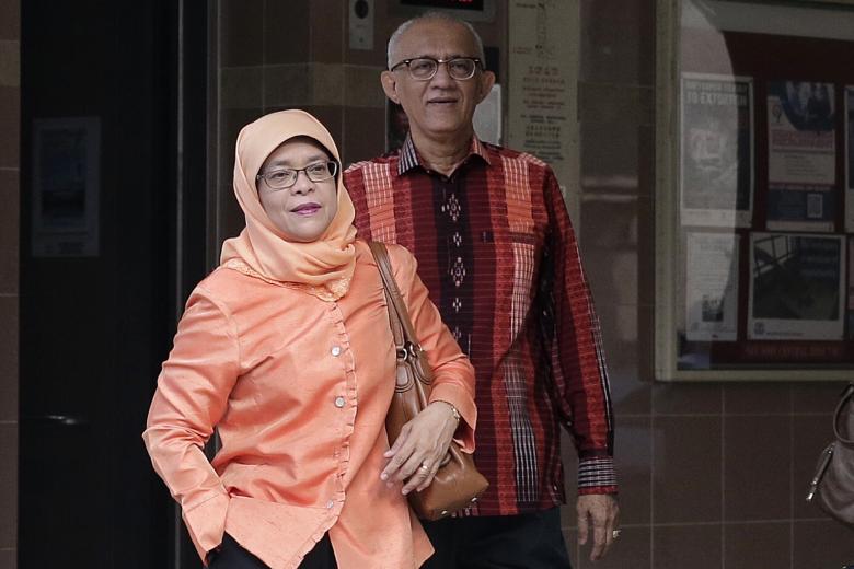 Madam Halimah Yacob and husband Mohamed Abdullah Alhabshee leaving their flat to head to the nomination centre yesterday.