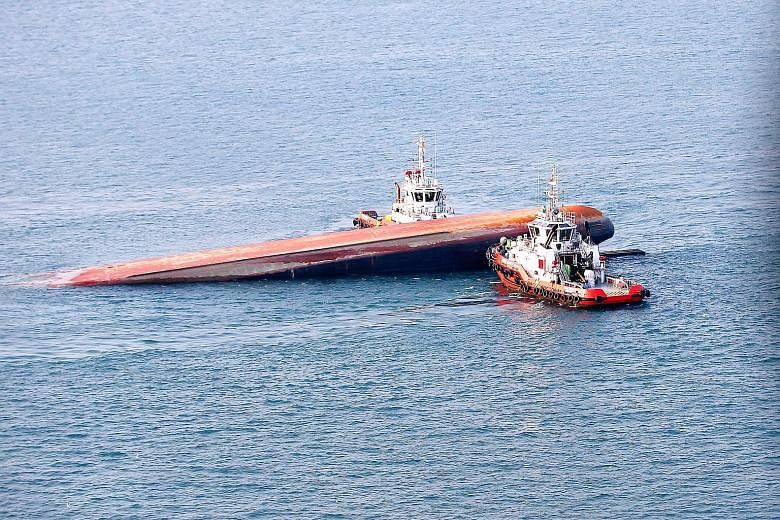 The Dominican-registered dredger JBB De Rong 19 capsized after its collision with Indonesian-registered tanker Kartika Segara on Wednesday. The accident left two dead and three missing. On Aug 21, a United States warship, USS John S. McCain, collided