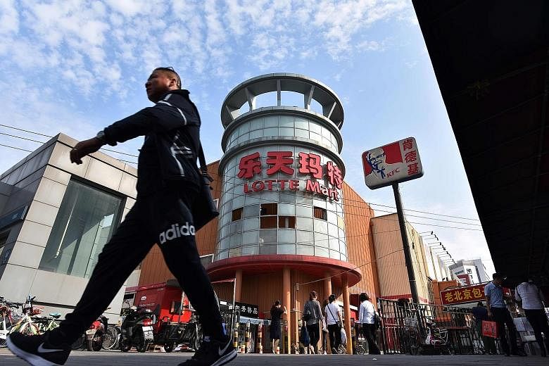 A shuttered Lotte Mart store in Beijing yesterday. The South Korean conglomerate, which was forced to close most of its 112 discount stores in China, has since expanded investments in Vietnam and Indonesia.
