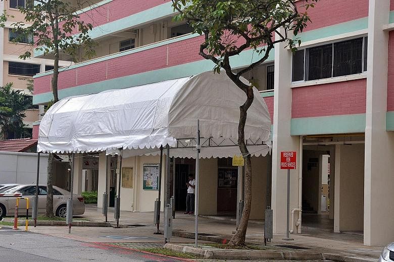 The white awning covers a carpark space reserved for police vehicles.