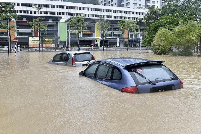 Rising waters reaching almost two metres affected more than 100 homes in Penang on Friday, and brought the morning rush hour traffic to a standstill as all main routes to the central business district in George Town were cut off. Firemen struggled to