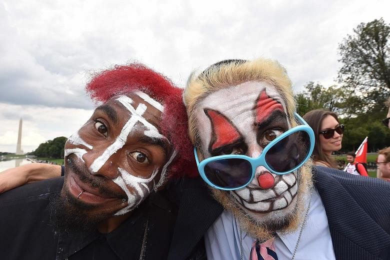 American rap group Insane Clown Posse's fans (above) protesting last Saturday in Washington against the Federal Bureau of Investigation's 2011 decision to classify them as gang members. The group was founded in 1989 by duo Violent J (Joseph Bruce) and Sha