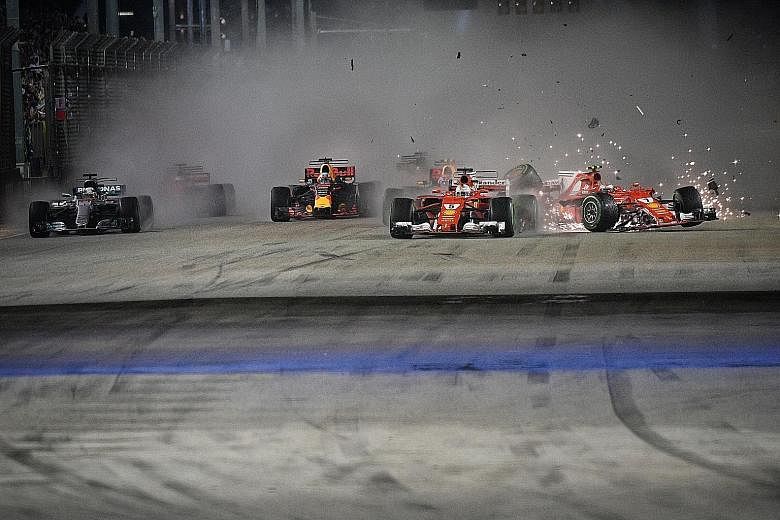 Ferrari's Sebastian Vettel (No. 5) and Kimi Raikkonen (right), and Red Bull's Max Verstappen (behind Vettel) in a crash early in the race. Mercedes' Lewis Hamilton (far left) won. Red Bull's Daniel Ricciardo (third from left) came second.