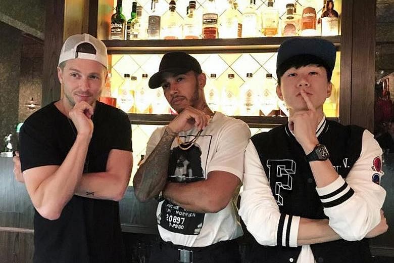 Hmmm... what would a track featuring Lewis Hamilton (centre), Ryan Tedder and JJ Lin sound like? Hanging out with the singers at Gibson Cocktail Bar should help the Mercedes driver ignite his music career.