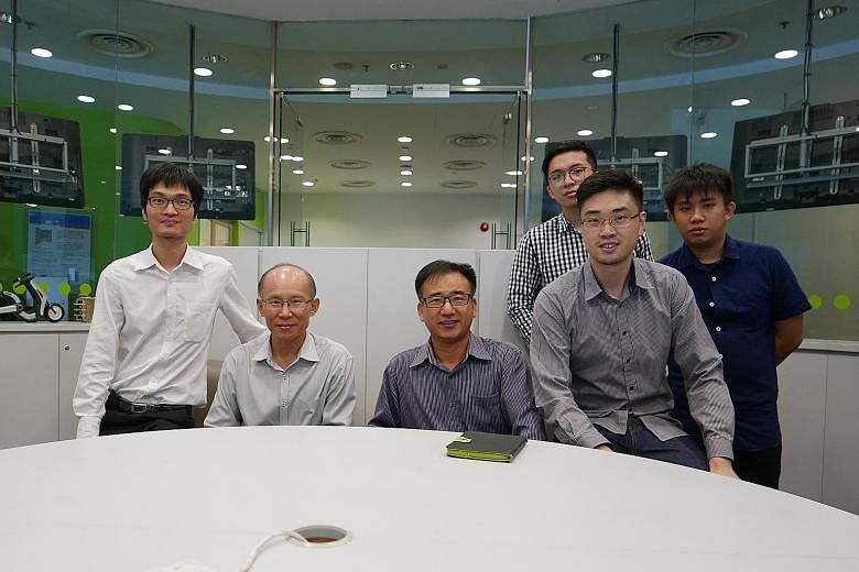 The group working to bring the lightweight, longer-lasting batteries to the market includes (from left) engineer Wang Lei and Dr Han Ming from Temasek Polytechnic's Clean Energy Research Centre, Dr Lu Jinchang and Mr Adec Thng from EnergyNova and stu