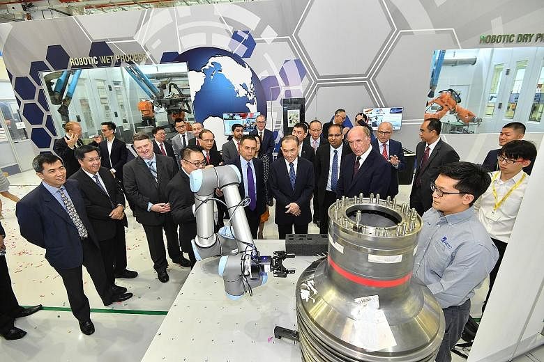 A demonstration of a smart assembly system at A*Star's Advanced Remanufacturing and Technology Centre on Sunday, when Rolls-Royce, A*Star and SAESL signed an agreement to invest up to $60 million to set up the Smart Manufacturing Joint Lab, which wil