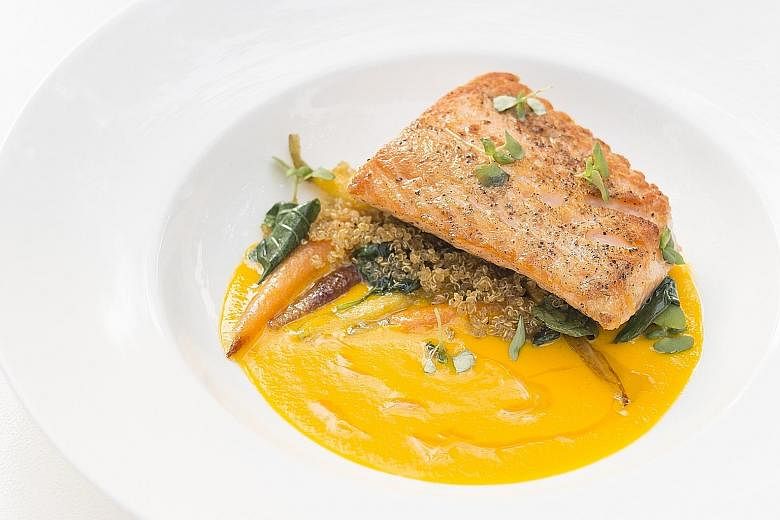 Chef Jean- Georges Vongerichten's new creations include miso-marinated grilled sirloin with coriander pesto and sesame seeds on a bed of wilted spinach; and seared salmon in a carrot-coconut sauce, with baby carrots and basil (above).