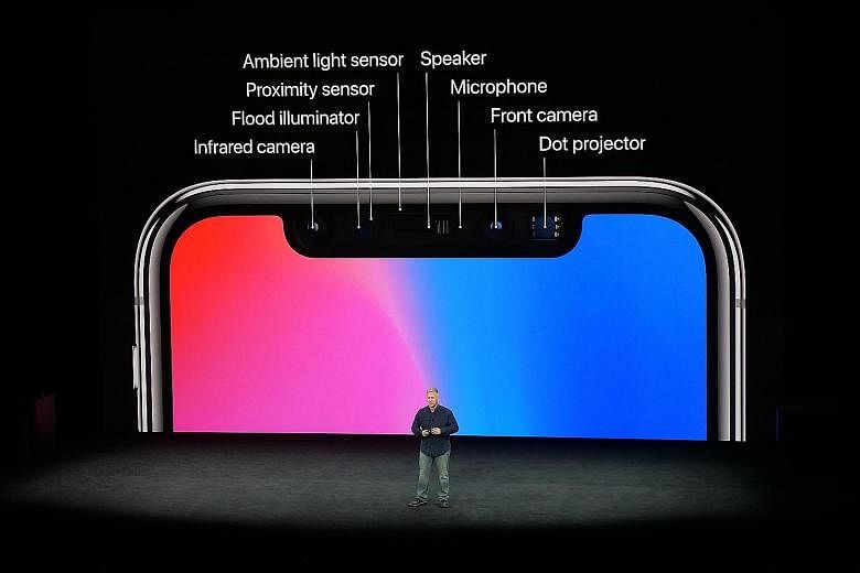 Apple marketing chief Phil Schiller showing off the iPhone X's TrueDepth camera system during the special event at Steve Jobs Theater, Apple Park, Cupertino, last week.