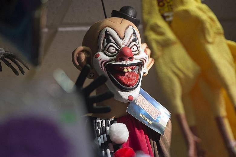 A scary clown mask on sale at a party costume store in Virginia. Last year, a series of creepy clown sightings were reported in more than a dozen US states, forcing police and schools to scramble to contain spreading jitters.