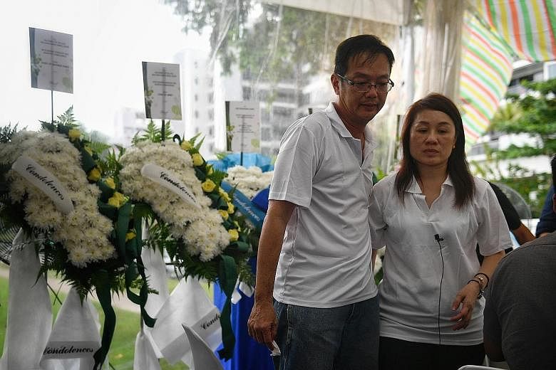 Mr Desmond Chan and Madam Lim Teck Kheng at the wake for their son Gavin (above) yesterday.