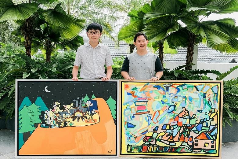 Mr Cavan Chang (far right), 29, who has Down syndrome, and Mr Aaron Yap, 22, who has autism, with their paintings, which will be auctioned at the Woh Hup annual dinner on Oct 5.