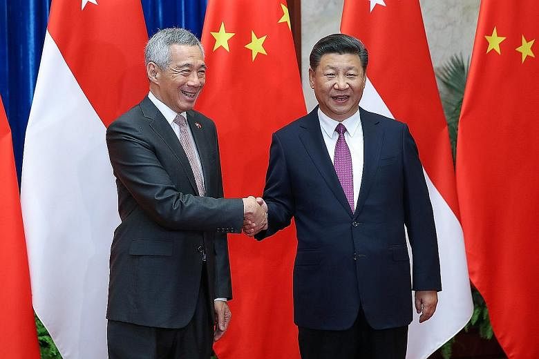 Prime Minister Lee Hsien Loong with Chinese President Xi Jinping before a meeting at the Great Hall of the People in Beijing yesterday. Both leaders agreed to continue working closely together to promote even stronger Asean-China ties.