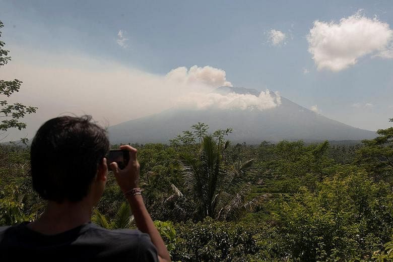 The authorities have raised alert levels for a volcano on the Indonesian resort island of Bali, after hundreds of small tremors stoked fears it could erupt for the first time in more than 50 years. Mount Agung, about 75km from the tourist hub of Kuta
