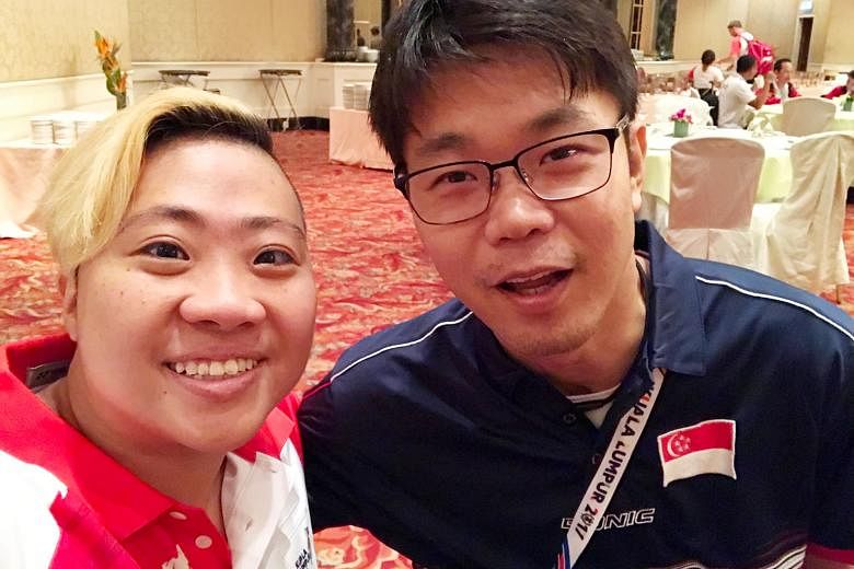 Theresa Goh with para-table tennis player Stanley Lim at the Kuala Lumpur Asean Para Games. Lim used to be a swimmer.