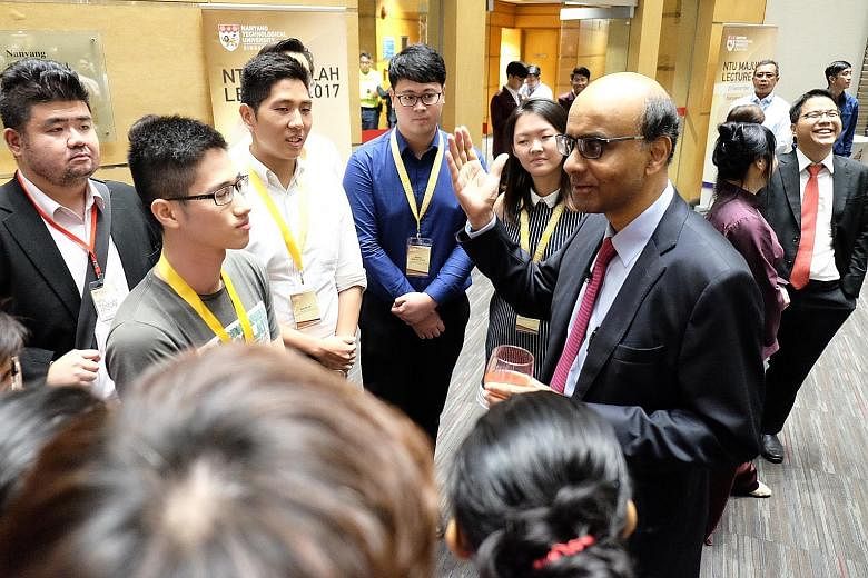 Deputy Prime Minister Tharman Shanmugaratnam having a chat with Nanyang Technological University students after the inaugural Majulah Lecture. In his nearly one-hour-long speech, he said the education system must keep changing and experimenting, or i