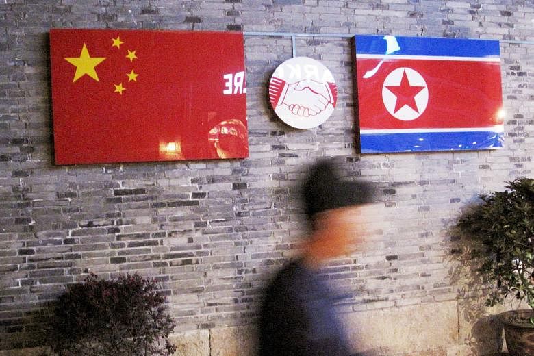 Flags of China and North Korea outside a restaurant in Ningbo, China's Zhejiang province. From an economic perspective, China is the only country that really matters to North Korea, as it controls about 90 per cent of North Korea's foreign trade and 