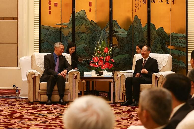 Prime Minister Lee Hsien Loong meeting Fujian party secretary You Quan. Mr You said the visit will further ties between China and Singapore.