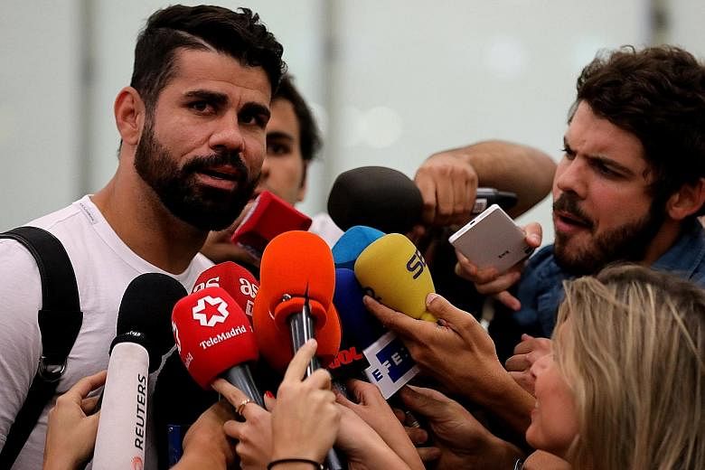 Chelsea's Diego Costa speaking to the media at Adolfo Suarez Madrid Barajas airport after arriving in the Spanish capital to finalise his transfer to Atletico Madrid. The Brazilian-born Spanish striker scored 20 goals to help Chelsea become English c