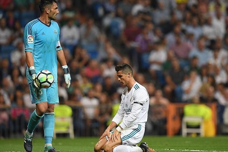 Portuguese star Cristiano Ronaldo is despondent after failing to beat Real Betis goalkeeper Antonio Adan in Real Madrid's 0-1 loss at the Santiago Bernabeu on Wednesday. It was the first time in 74 games that Real, who are a lowly eighth in the LaLig