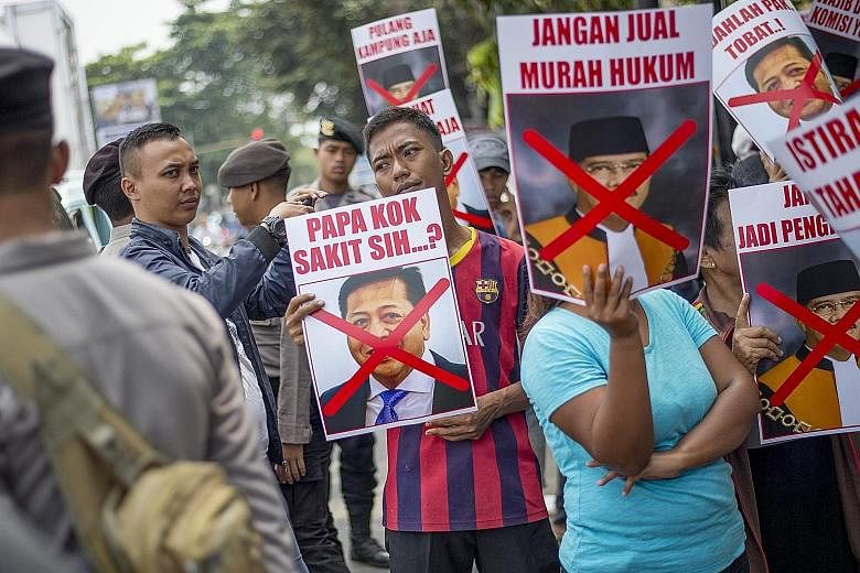 Demonstrators rallying in front of the South Jakarta court earlier this month to protest as Mr Setya Novanto filed a pretrial lawsuit against KPK to challenge the legality of its decision to call him a suspect in a 2010 corruption probe.