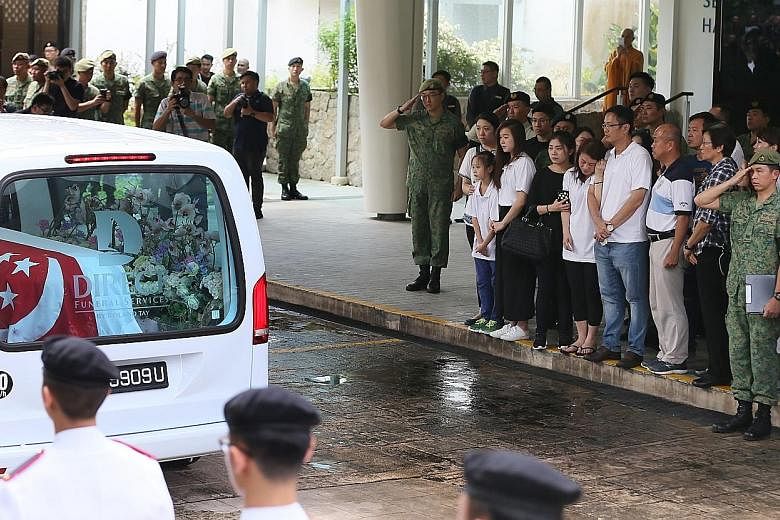 At the Mandai Crematorium yesterday, apart from family and friends, 300 servicemen lined the driveway to receive 3SG Gavin Chan's hearse. Later, six soldiers fired three volleys as a salute, and a minute of silence was observed as the bugler sounded 