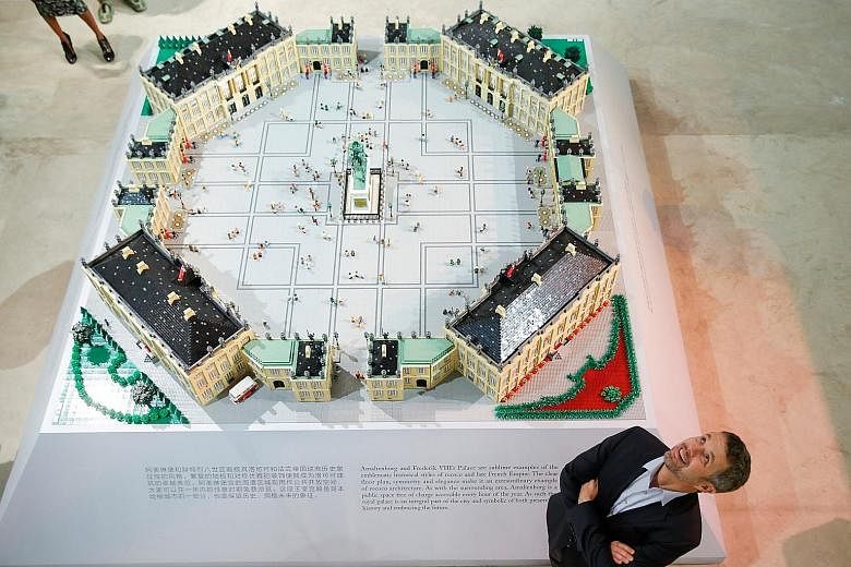 […]Danish Crown Prince Frederik standing next to a model of Amalienborg Palace - home of the Danish royal family - made of Lego bricks at the Danish Cultural Centre in Beijing yesterday.