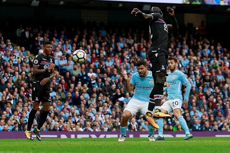 Sergio Aguero putting Manchester City four up, after Crystal Palace's goalkeeper Wayne Hennessey was unable to keep out the Argentinian's header. City's win compounded the misery on Roy Hodgson's side, while keeping them ahead of city rivals United a