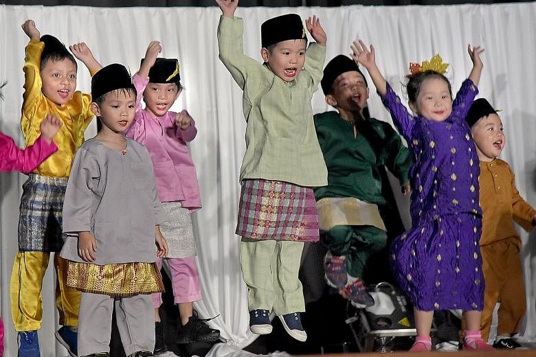 Children from PCF Sparkletots Preschool performing at Gerbang Bahasa held at Northbrooks Secondary School in Yishun last night.