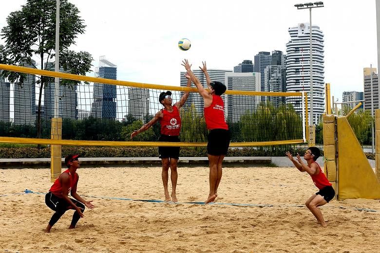 From left: National beach volleyball players Zhuo Hong Chuan, Gilbert Tan, Mark Shen and Poon Pei Jie training at the Singapore Sports Hub ahead of the Sept 28-30 South-east Asian Beach Volleyball Championships, which will be held at Sentosa's Palawa