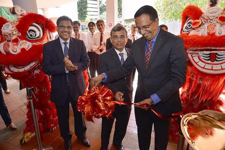 Mr Jawed Ashraf (centre), the High Commissioner of India to Singapore, was the guest of honour at the inauguration of the State Bank of India's (SBI) Ang Mo Kio branch yesterday. With him were SBI chief executive officer Manaw Prasad (far left) and S