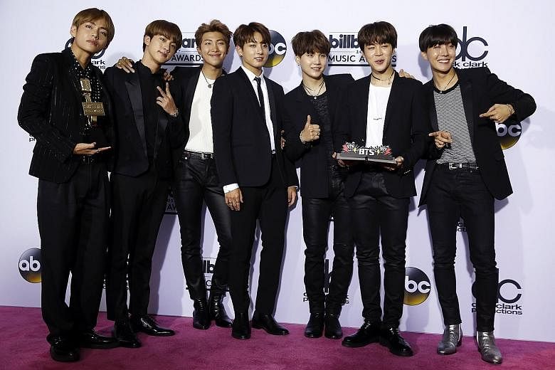 BTS with their Top Social Media Artist award at the Billboard Music Awards in May.
